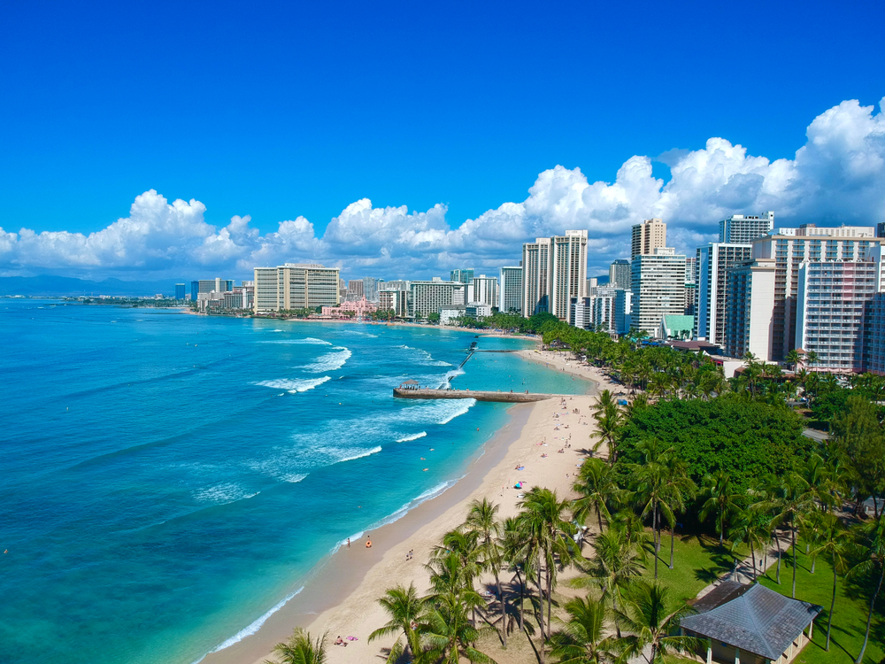 Aerial view of Waikiki Beach and Honolulu skyline with turquoise ocean