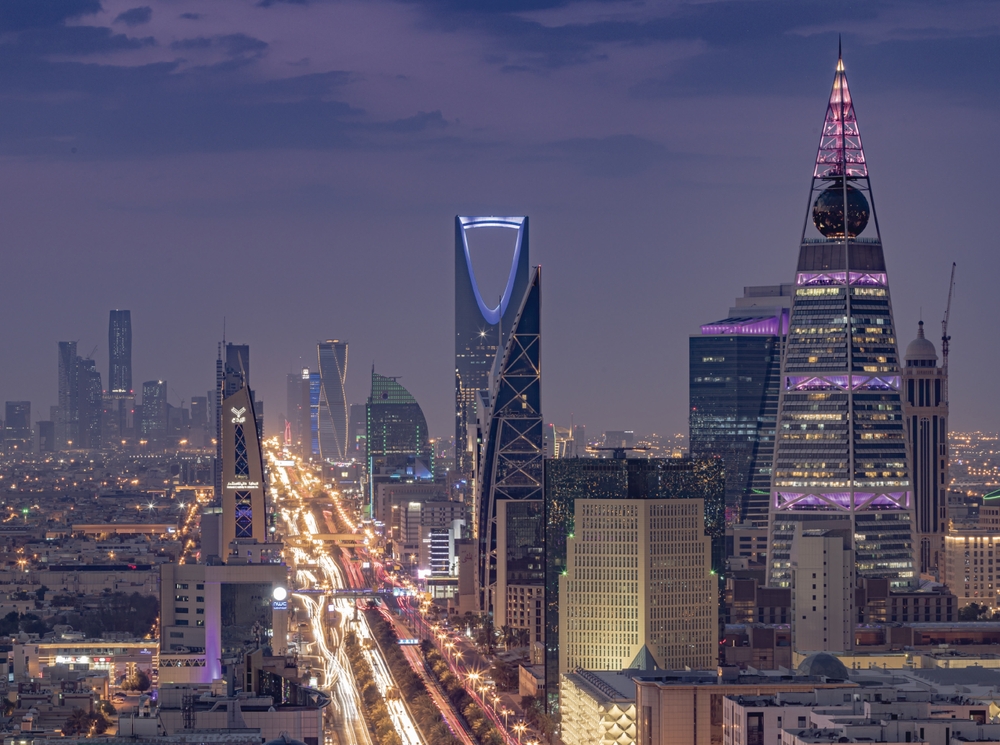 Riyadh skyline at night with Kingdom Centre tower and illuminated highways