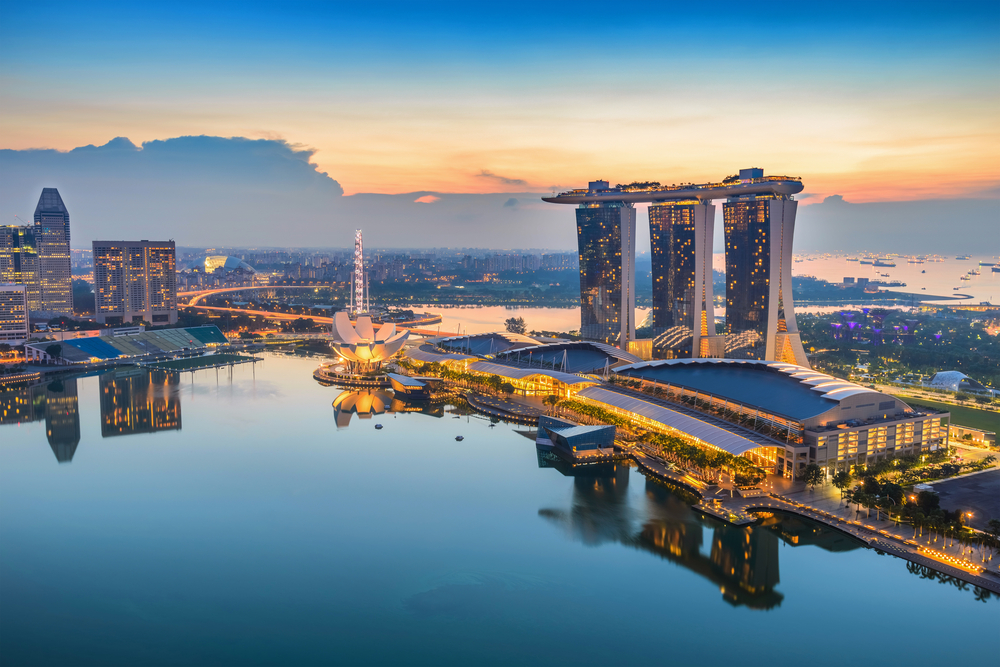 Singapore skyline at sunset with Marina Bay Sands and waterfront