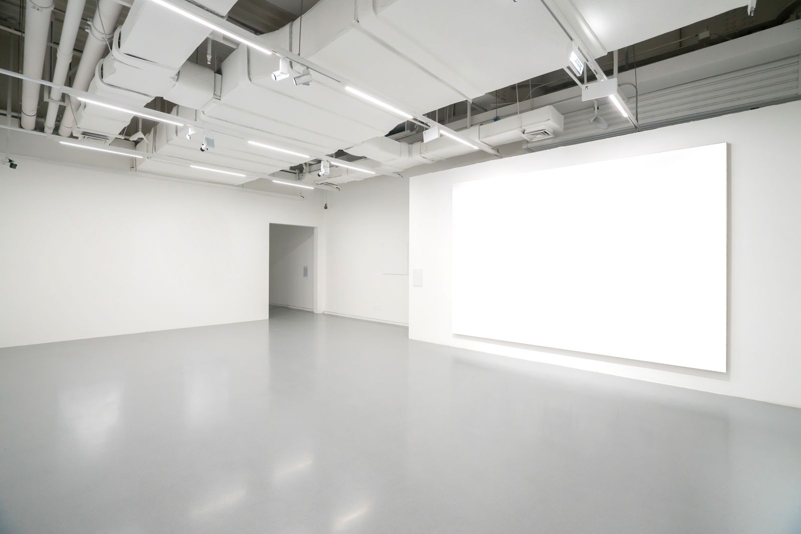 Bright, empty white contemporary art gallery space