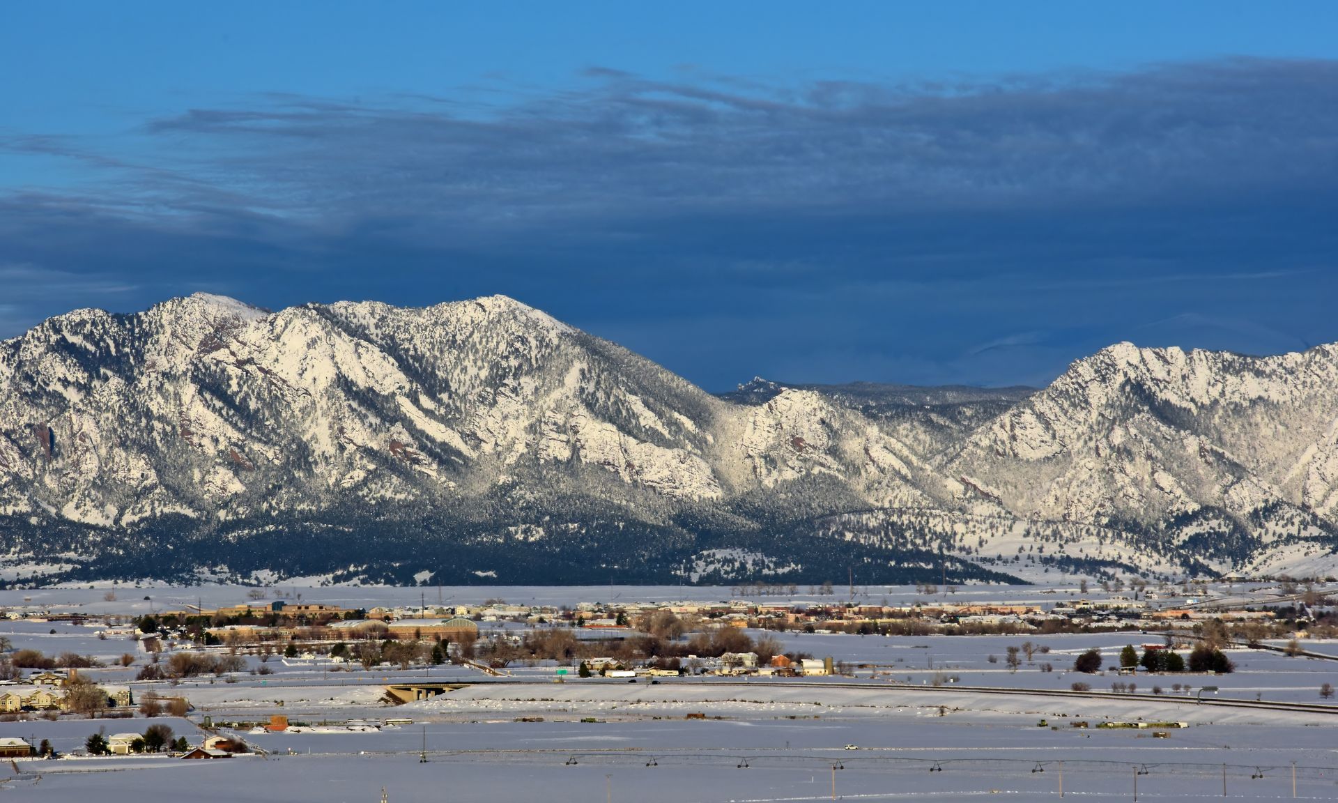 Snow-covered Boulder Flatirons and Colorado Front Range in winter