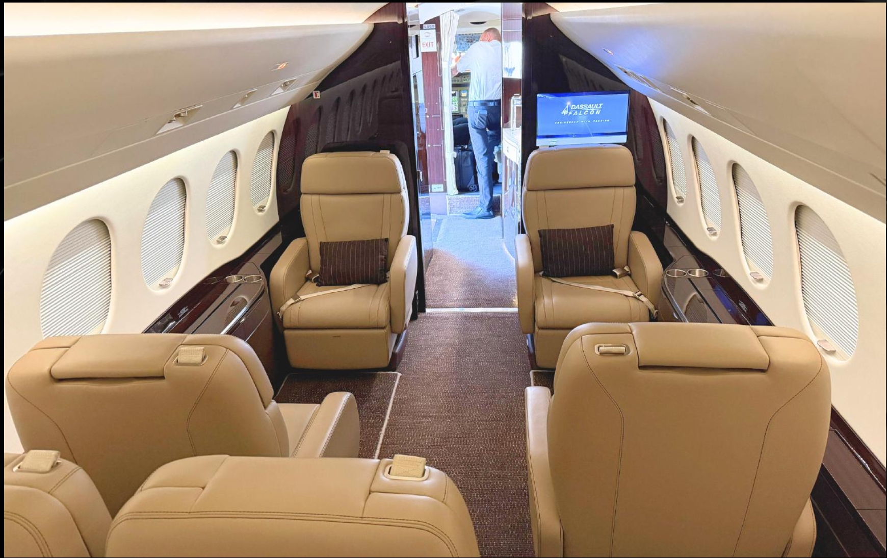 Falcon 7X forward club seating with beige leather