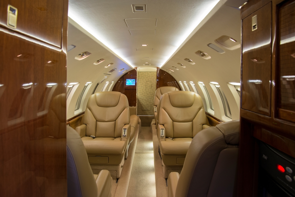 Luxury private jet cabin interior with leather seats